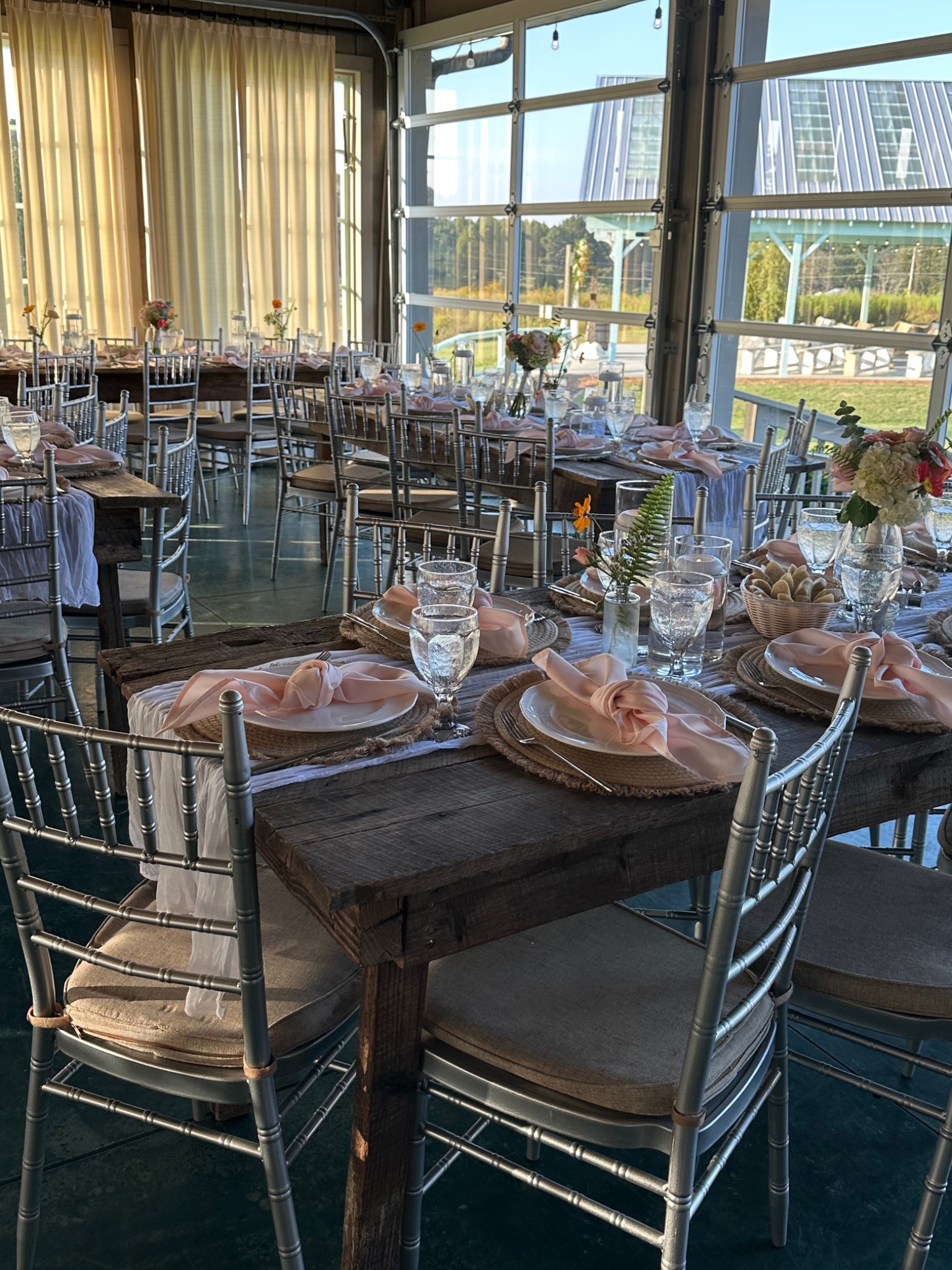 A beautifully styled wedding reception with elegant table settings