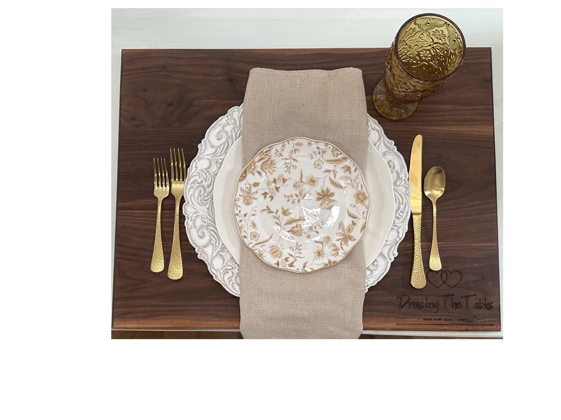Neutral and gold place setting with vintage floral china and amber glassware